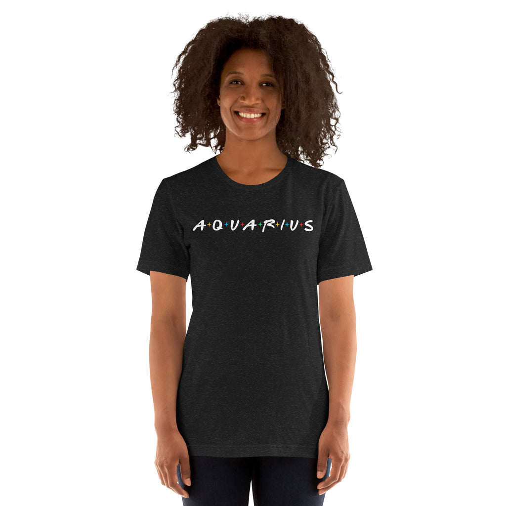 Woman wearing Aquarius zodiac 90s nostalgia graphic t-shirt in black, retro astrology apparel 