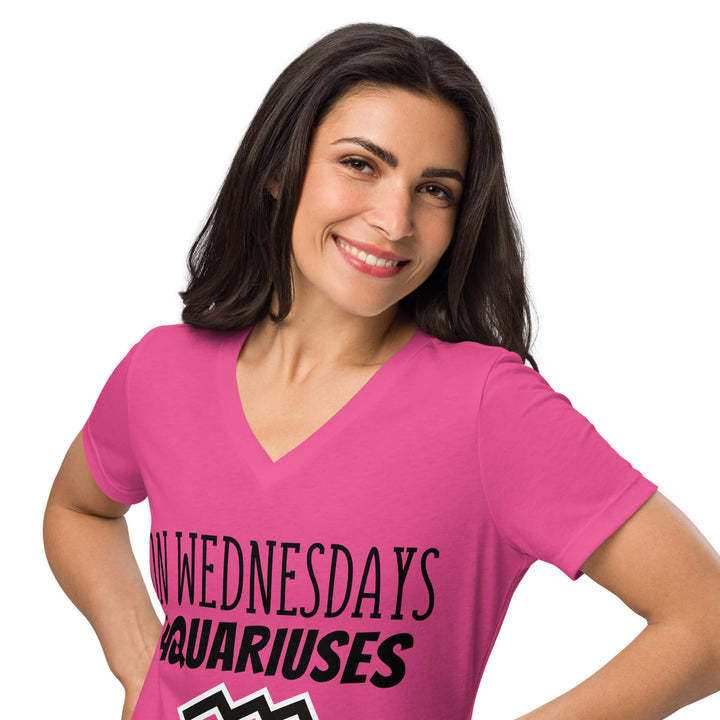Woman smiling in a hot pink “On Wednesdays Aquarius Wear Pink”  V-neck shirt.