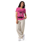Woman wearing Aries zodiac "Wears Pink" graphic v-neck t-shirt in pink, women's astrology apparel