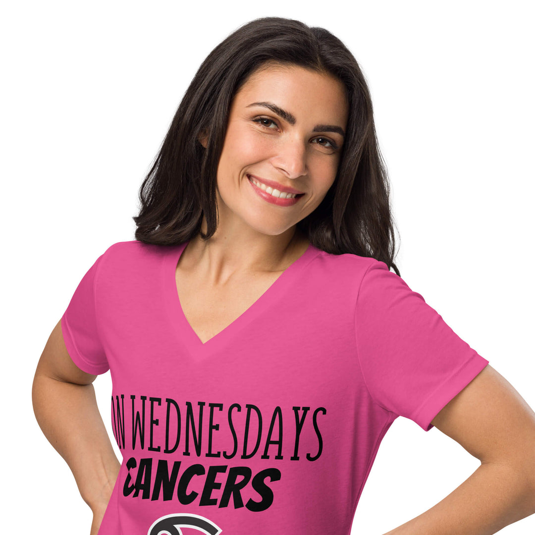 Woman smiling in a hot pink “On Wednesdays Cancers Wear Pink”  V-neck shirt.