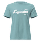 "In My Aquarius Era" zodiac graphic t-shirt, lagoon blue, women's fitted astrology apparel, front flat lay