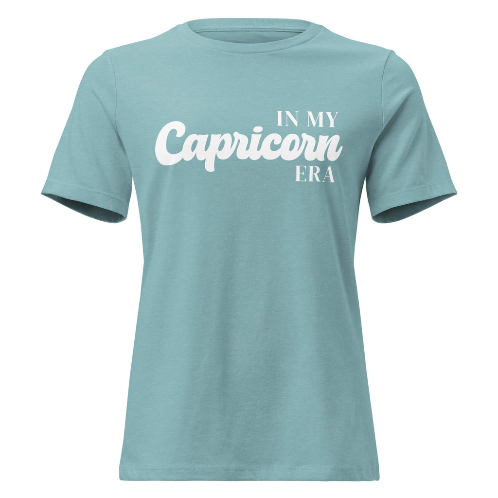 "In My Capricorn Era" zodiac graphic t-shirt, lagoon blue, women's fitted astrology apparel, front flat lay