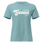 "In My Gemini Era" zodiac graphic t-shirt, lagoon blue, women's fitted astrology apparel, front flat lay