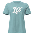 "In My Leo Era" zodiac graphic t-shirt, lagoon blue, women's fitted astrology apparel, front flat lay