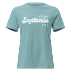 "In My Sagittarius Era" zodiac graphic t-shirt, lagoon blue, women's fitted astrology apparel, front flat lay