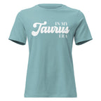"In My Taurus Era" zodiac graphic t-shirt, lagoon blue, women's fitted astrology apparel, front flat lay