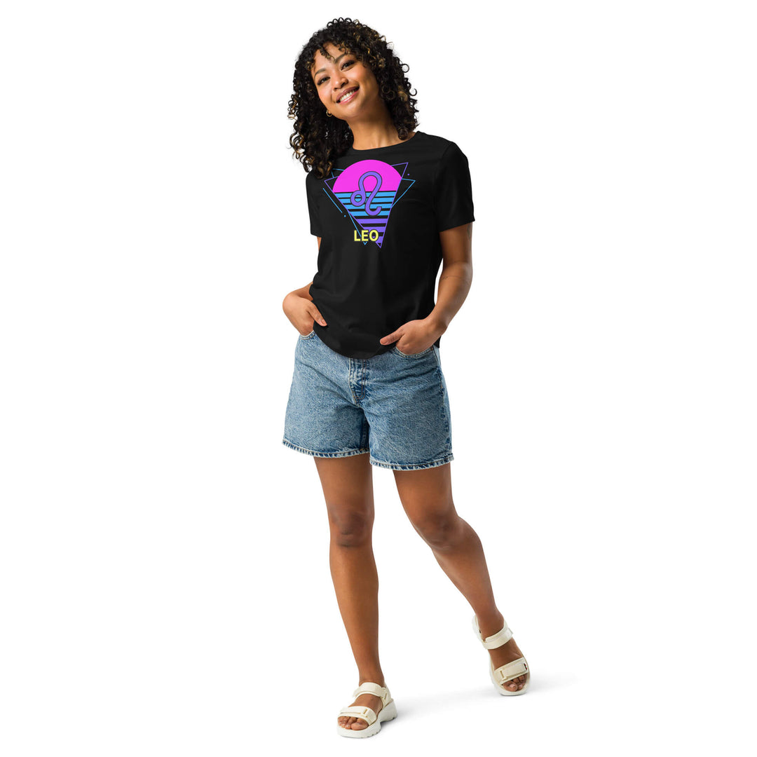 Woman wearing Leo retro 80s zodiac shirt with neon pink sun, styled with denim shorts