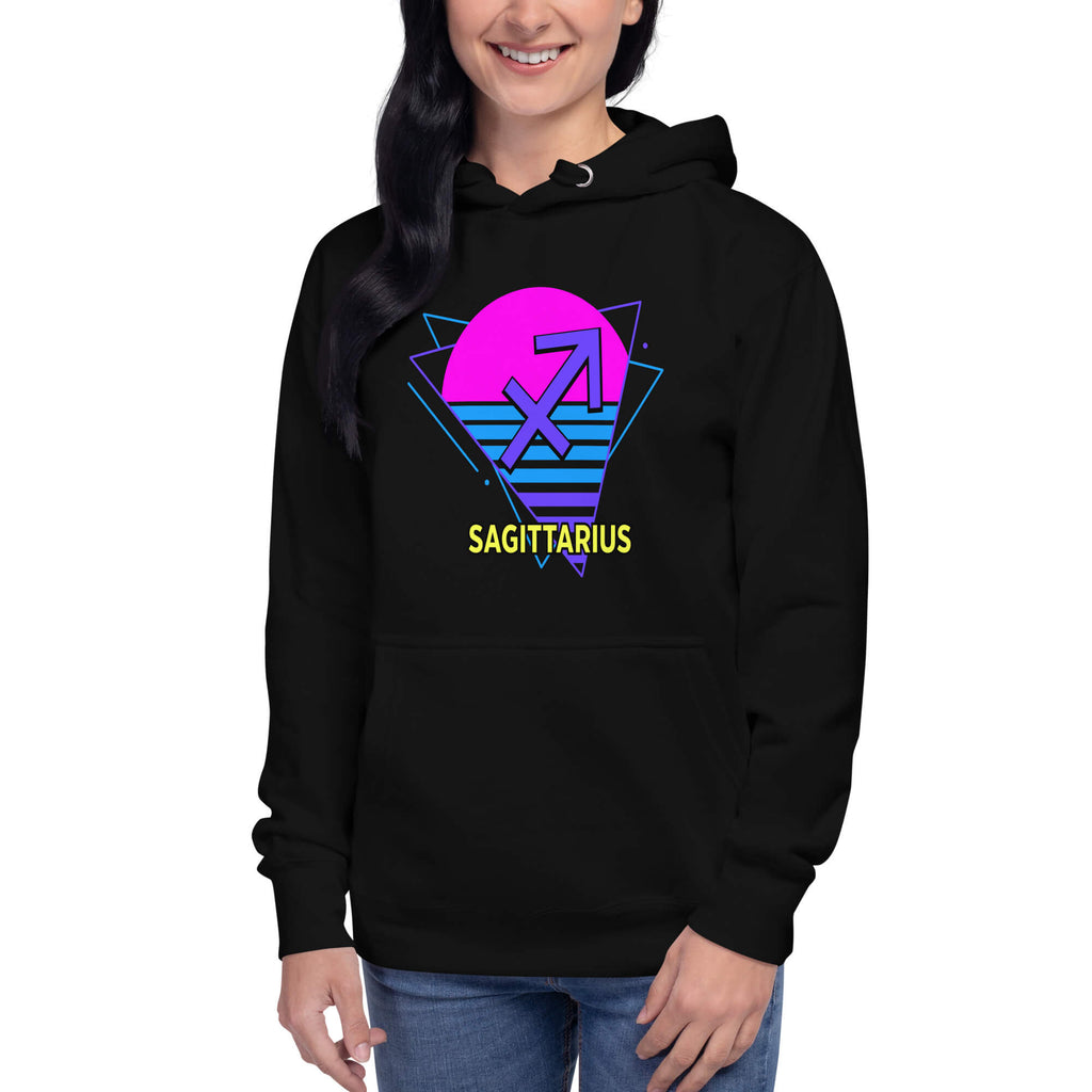 Person wearing Sagittarius zodiac retro 80s graphic pullover hoodie in black with purple design, unisex astrology apparel