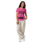 Woman wearing Sagittarius zodiac "Wears Pink" graphic v-neck t-shirt in pink, women's astrology apparel
