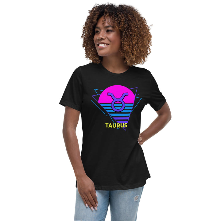 Woman wearing taurus retro 80s astrology t-shirt with neon pink sun, styled with denim shorts
