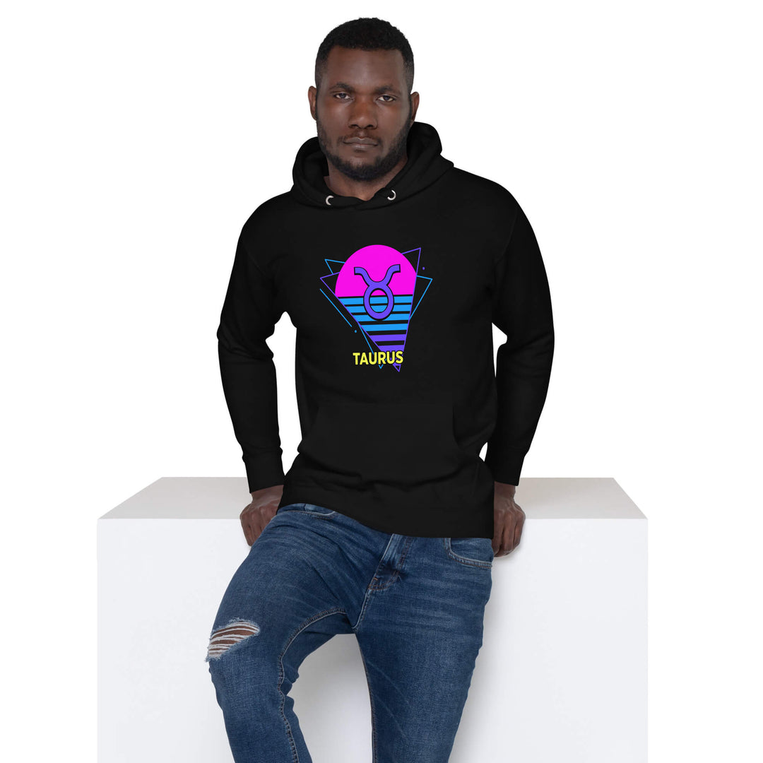 Person wearing a black hoodie with Aquarius design on a white background