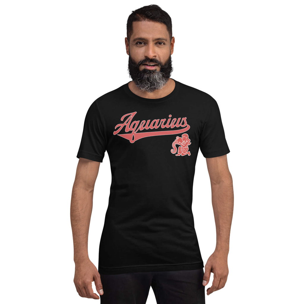 A man wearing a black short-sleeve t-shirt with a pink 'Aquarius' script graphic and mascot on the chest, set against a plain white background.