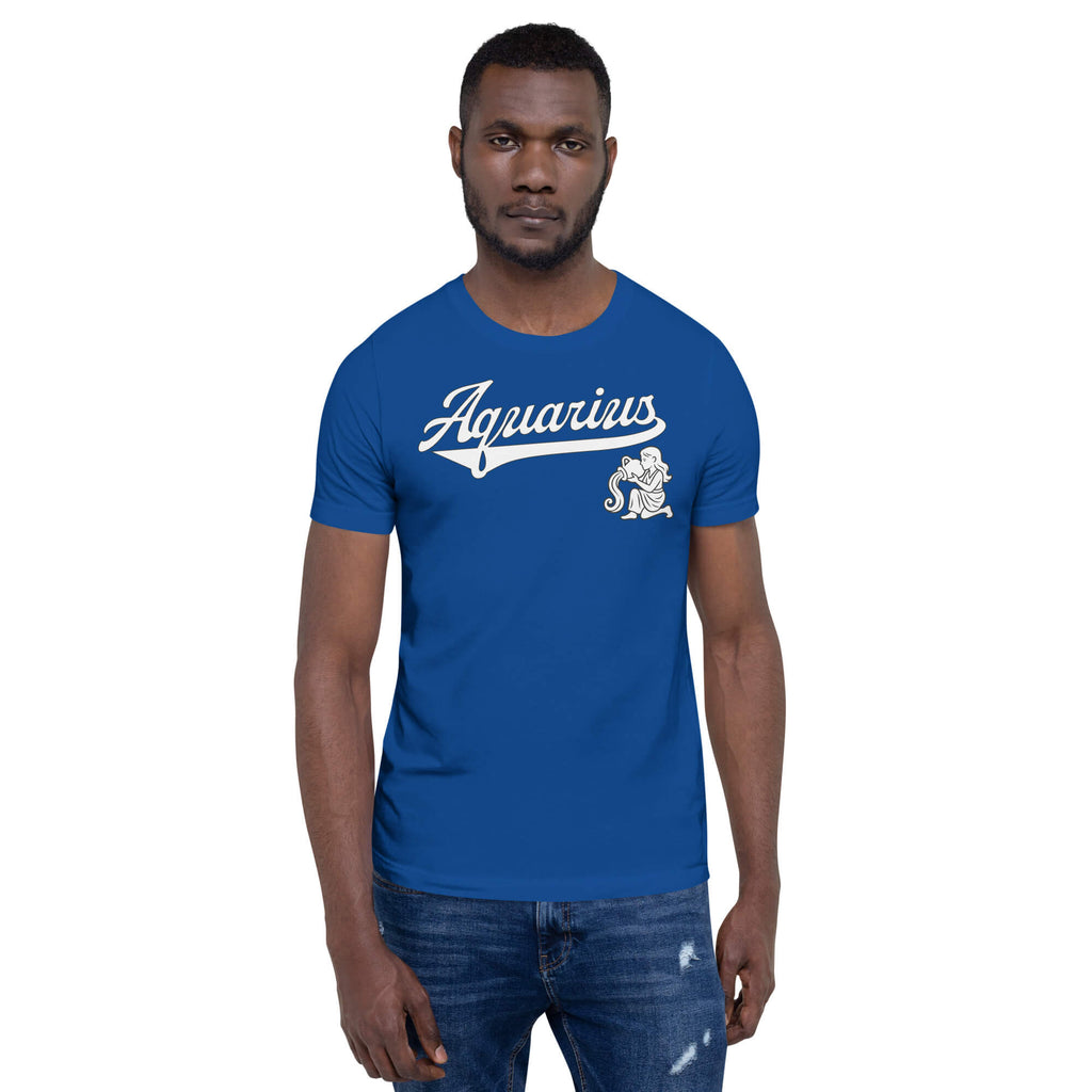 A man wearing a royal blue crewneck t-shirt with a white 'Aquarius' script and zodiac graphic on the chest, paired with blue jeans, set against a plain white background.