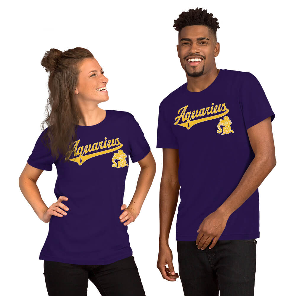 A man and a woman modeling matching purple short-sleeve t-shirts with a gold 'Aquarius' script and mascot on the chest, set against a plain white background.