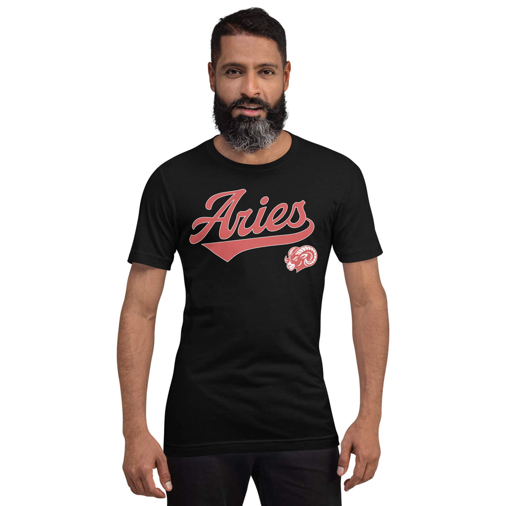A man with a beard wearing a black crewneck t-shirt with a red 'Aries' graphic and a small red ram logo on the chest, set against a plain white background.
