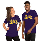 A man and a woman modeling matching purple t-shirts with a colorful retro-style 'Aries' graphic on the chest, set against a plain white background.