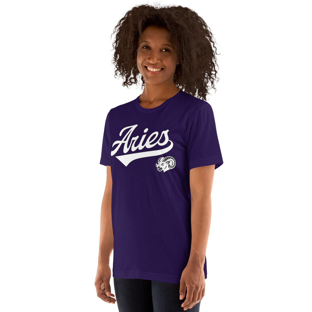 A woman with curly dark hair wearing a purple short-sleeve t-shirt with a white 'Aries' script and ram logo on the front, set against a plain white background.