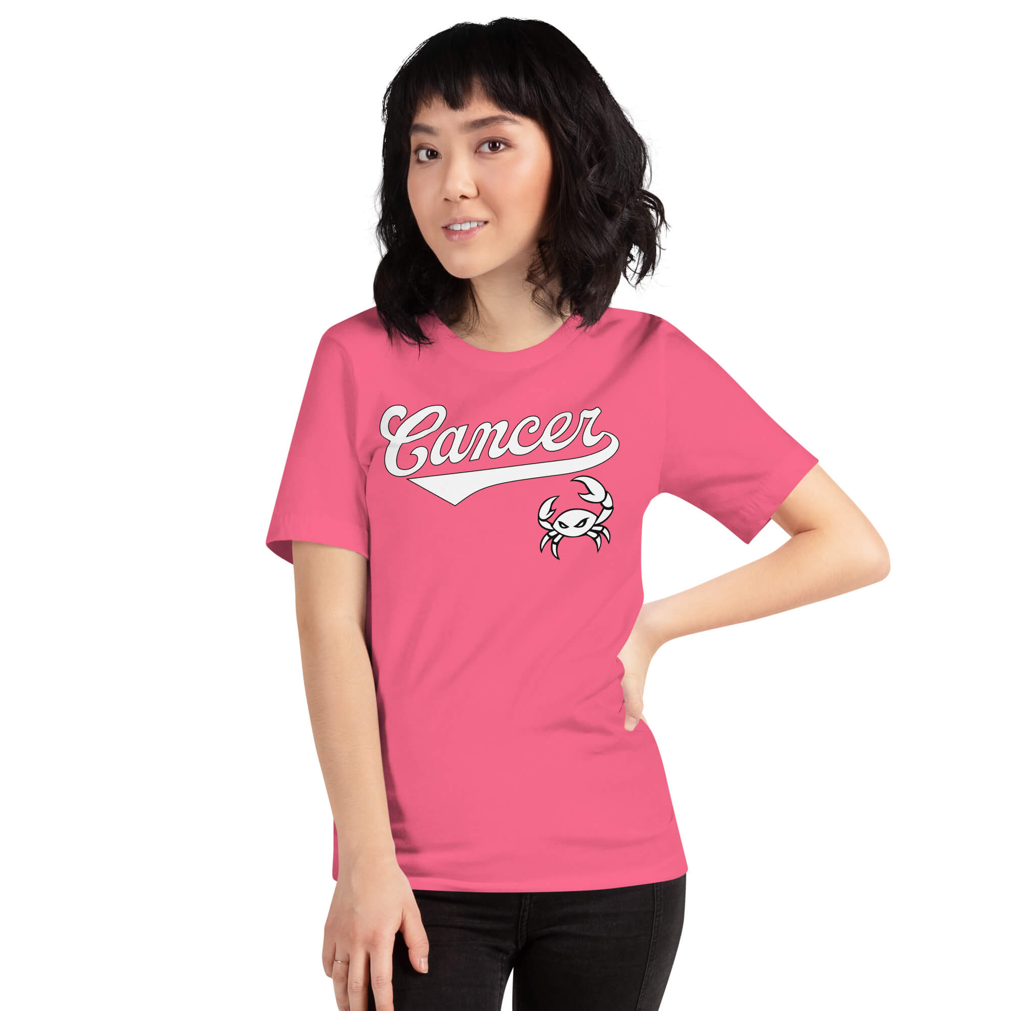 A woman modeling a bright pink short-sleeve t-shirt with a white 'Cancer' script and crab graphic on the front, set against a plain white background.