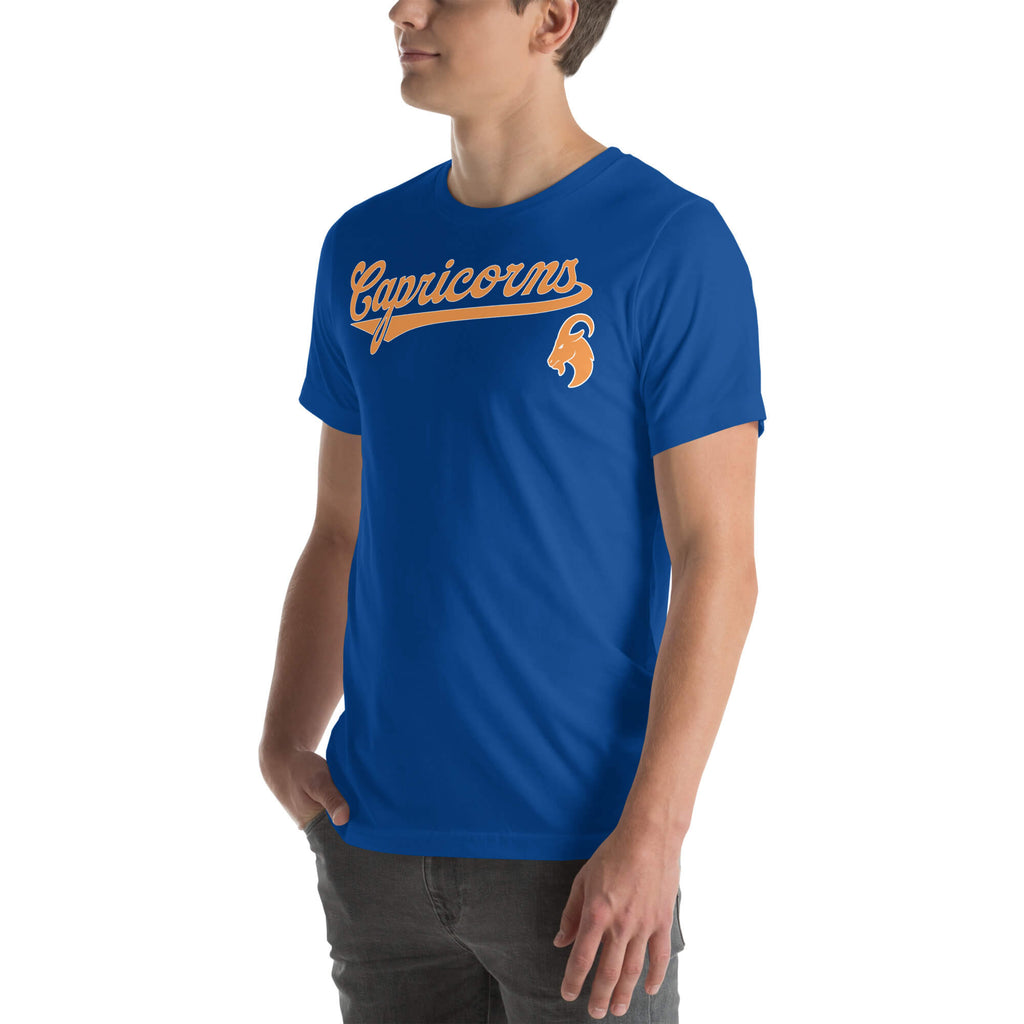 Person wearing a blue t-shirt with an orange Capricorn design on a white background
