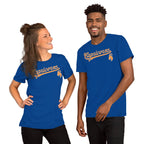 A man and a woman modeling matching royal blue t-shirts with a orange 'Capicorns' script and a small capricorn graphic on the chest, set against a plain white background.