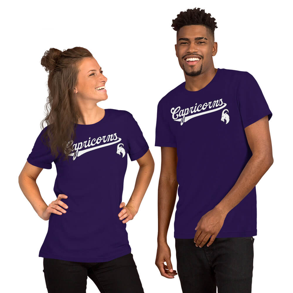 Two people wearing purple t-shirts with Capricorn zodiac graphics on a white background