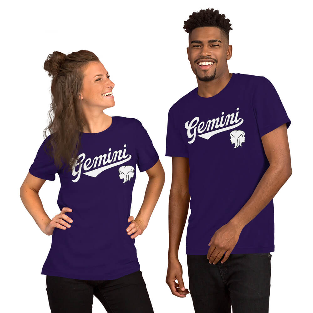 A man and a woman modeling matching purple short-sleeve t-shirts with a white 'Gemini' script and zodiac symbol on the chest, set against a plain white background.