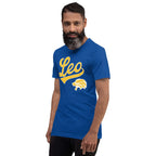 A man with a beard wearing a royal blue t-shirt with a gold and white graphic that reads 'Leo' and features a lion head logo, set against a plain white background.
