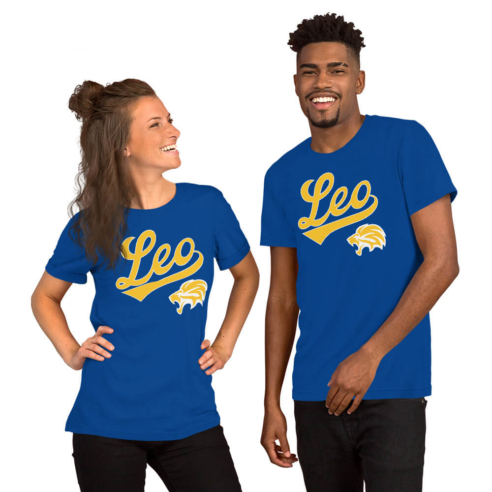 A man and a woman modeling matching royal blue t-shirts with a gold 'Leo' script and lion graphic on the chest, set against a plain white background.