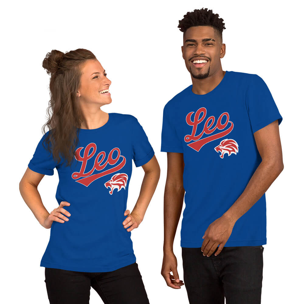 A man and a woman modeling matching royal blue t-shirts with a red and white 'Leo' script and wildcat graphic on the chest, set against a plain white background.