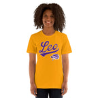 A smiling woman with curly dark hair wearing a gold short-sleeve t-shirt with a purple 'Leo' script and lion graphic on the front, set against a plain white background.