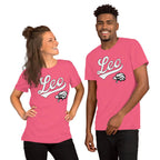 A man and a woman modeling matching bright pink t-shirts with a white 'Leo' script and a black-and-white animal head graphic on the chest, against a plain white background.
