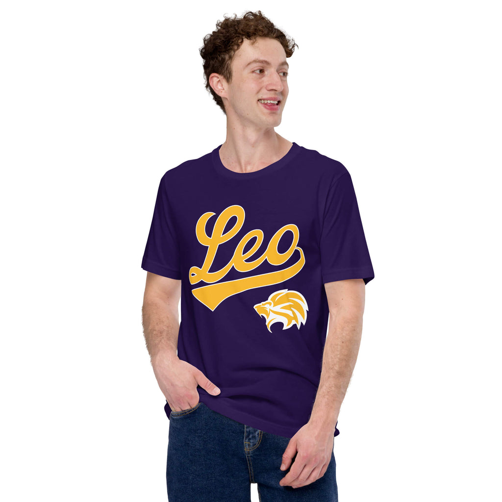 A man wearing a purple short-sleeve t-shirt with a gold 'Leo' script and a lion graphic on the front, paired with blue jeans, against a plain white background.