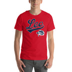A man wearing a red short-sleeve t-shirt with a navy blue and white 'Leo' script graphic and a lion head logo on the chest, paired with gray jeans against a plain white background.