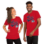 A man and a woman modeling matching red short-sleeve t-shirts with a navy blue and white 'Leo' script and zodiac mascot on the chest, set against a plain white background.