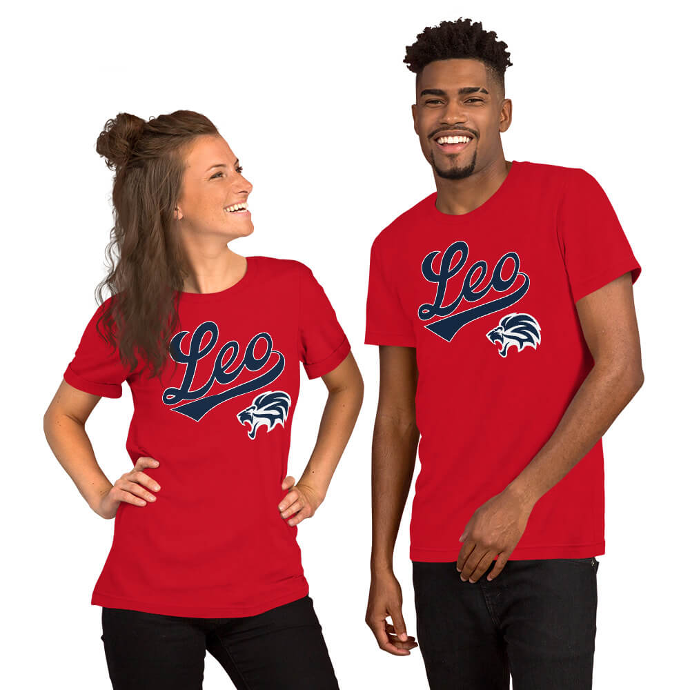 A man and a woman modeling matching red short-sleeve t-shirts with a navy blue and white 'Leo' script and zodiac mascot on the chest, set against a plain white background.