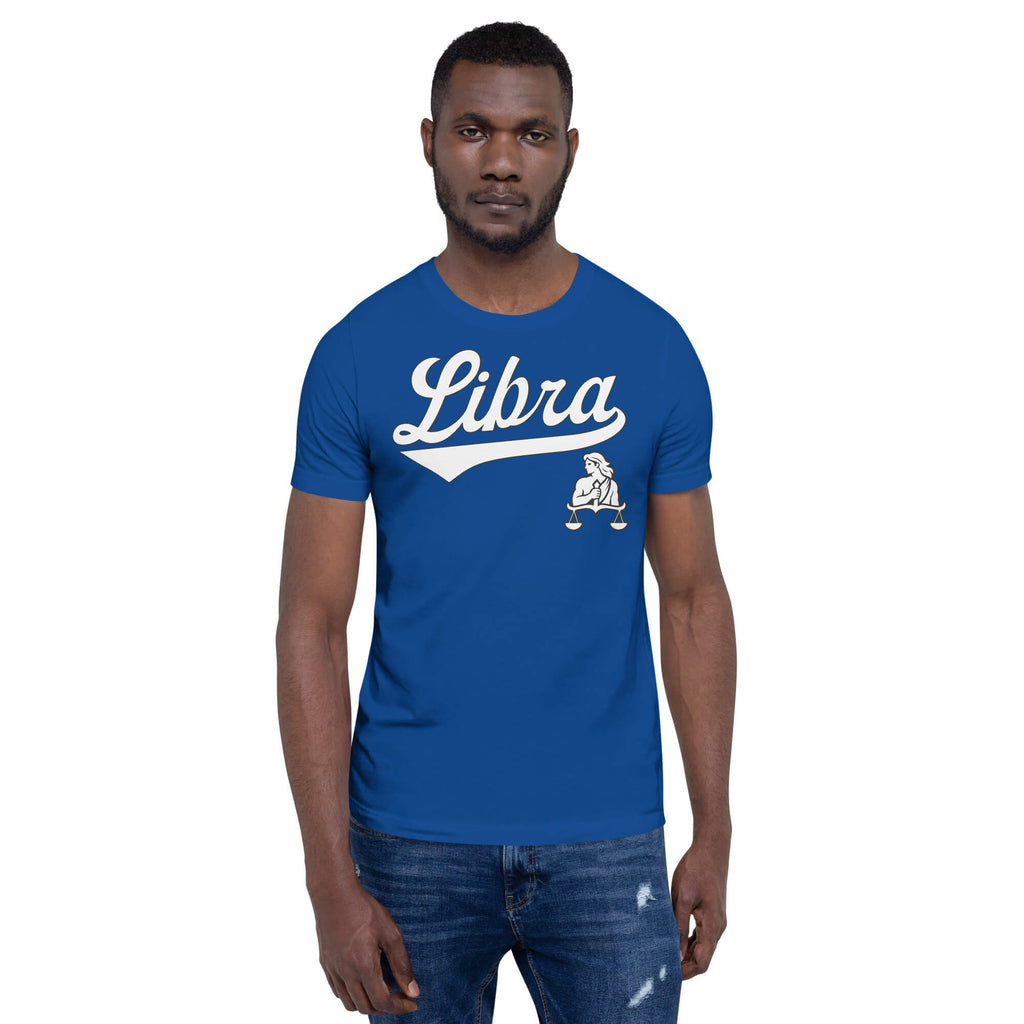 A man wearing a royal blue crewneck t-shirt with a white 'Libra' graphic and a small Libra zodiac symbol on the chest, paired with blue jeans, against a plain white background.