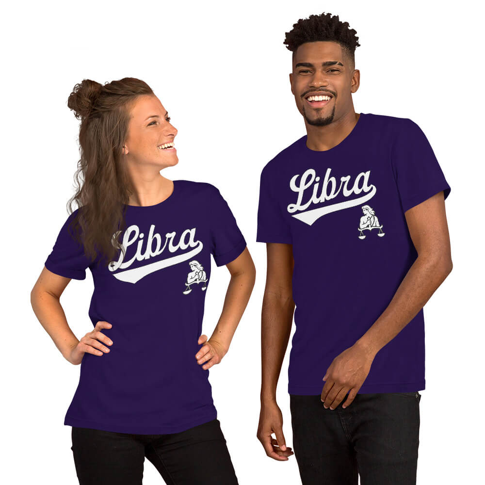 A man and a woman modeling matching purple t-shirts with a white 'Libra' script and a small Libra zodiac graphic on the front, set against a plain white background.