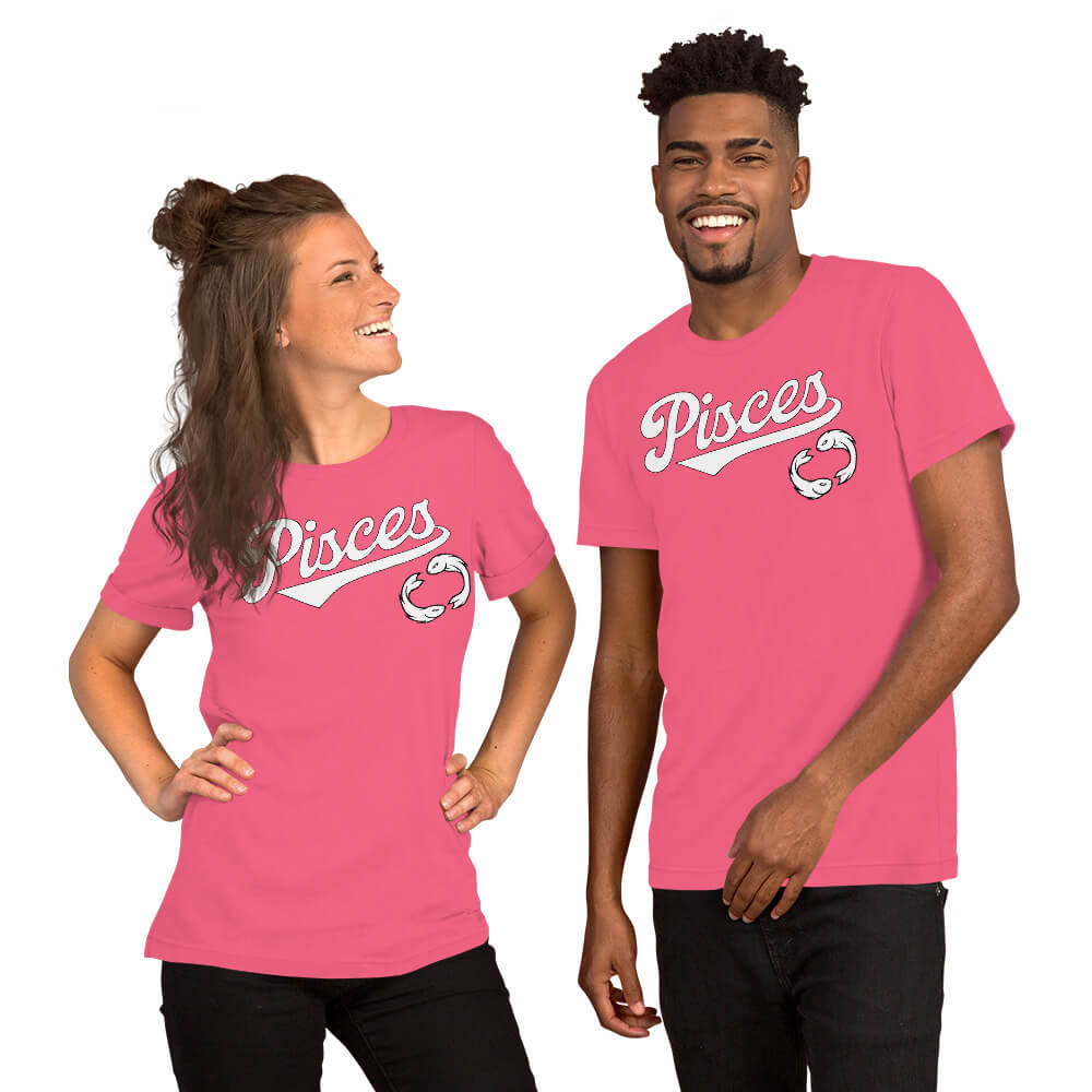 A man and a woman modeling matching bright pink t-shirts with 'Pisces' written in white script across the chest, set against a plain white background.