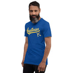 A man with a beard wearing a royal blue t-shirt with a gold 'Sagittarius' graphic and an arrow symbol on the chest, set against a plain white background.