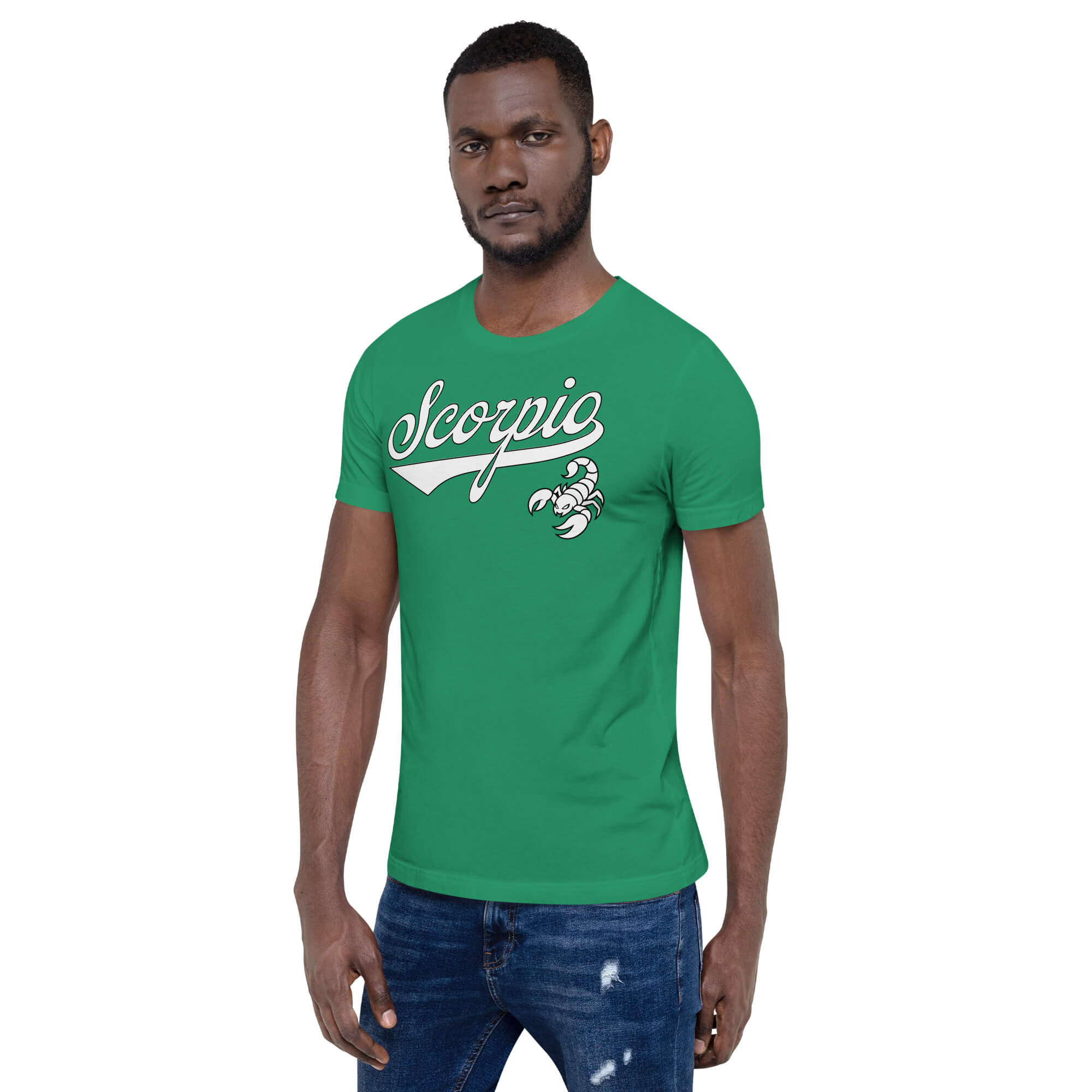 A man wearing a green crew-neck t-shirt with a white 'Scorpio' zodiac graphic on the chest, paired with blue jeans, against a plain white background.