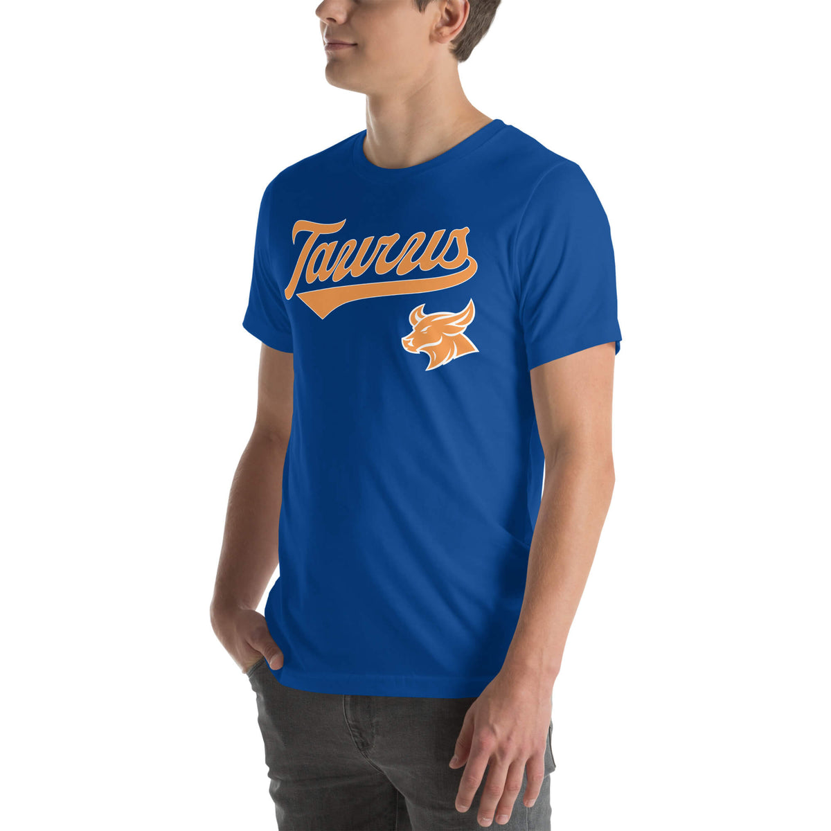 A man wearing a royal blue crewneck t-shirt with a retro-style orange and white 'Taurus' zodiac graphic on the chest, shown against a plain white background.