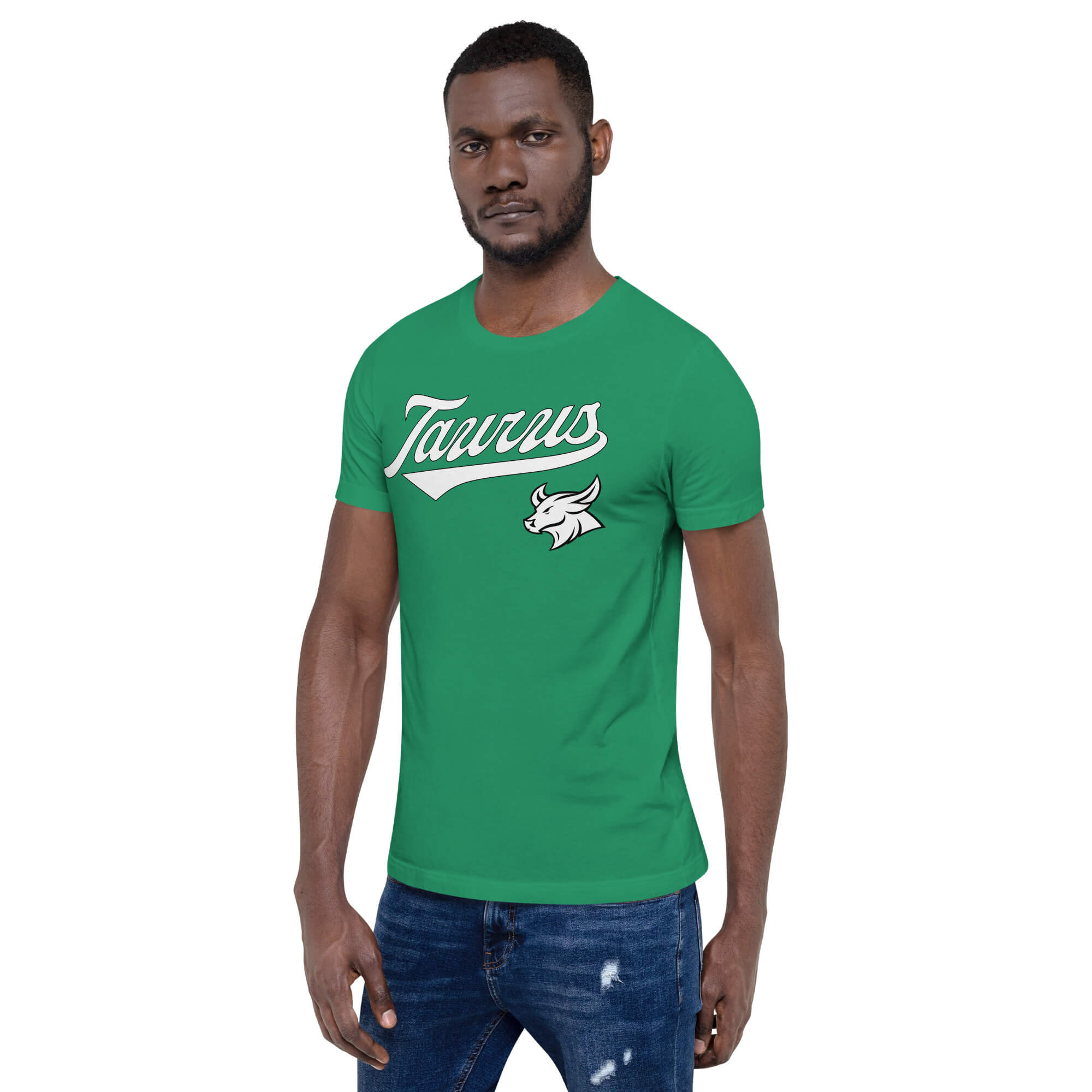 A man modeling a green crewneck t-shirt with a white 'Taurus' script logo and a white bull graphic on the chest, paired with blue jeans against a plain white background.
