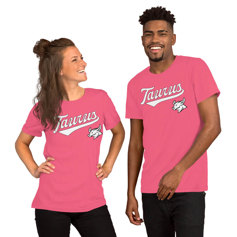 A man and a woman modeling matching pink short-sleeve t-shirts with a white 'Taurus' zodiac graphic on the chest, set against a plain white background.
