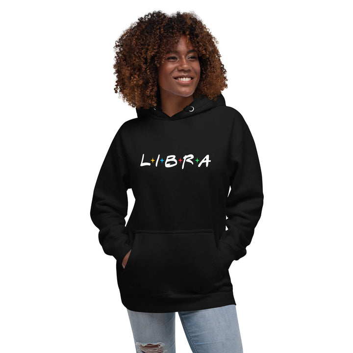 Person wearing a black hoodie with 'LIBRA' text on a white background