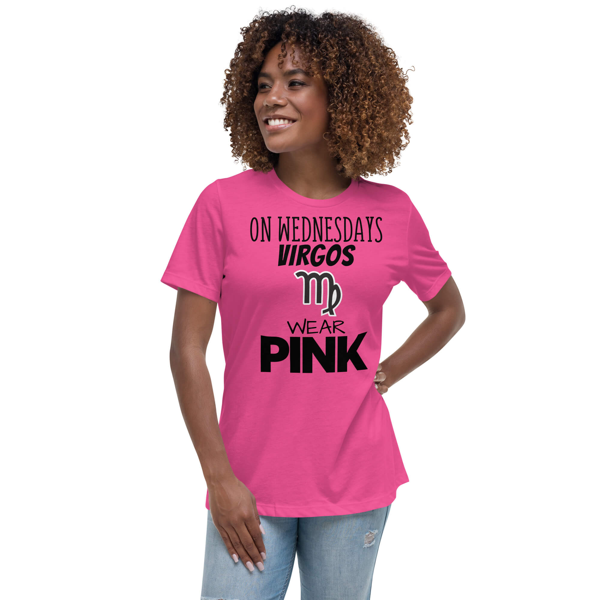 Woman wearing a pink “On Wednesdays Virgos wear pink” t-shirt with the Virgo symbol.